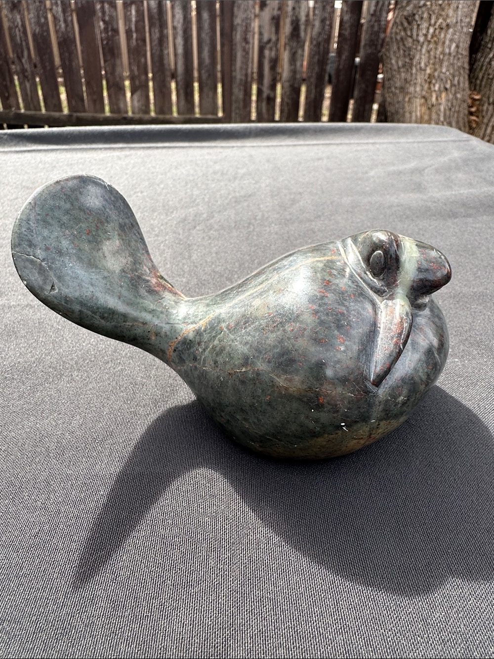 Inuit Soapstone carving artist signed.
